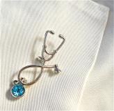 stethoscope/initial pin